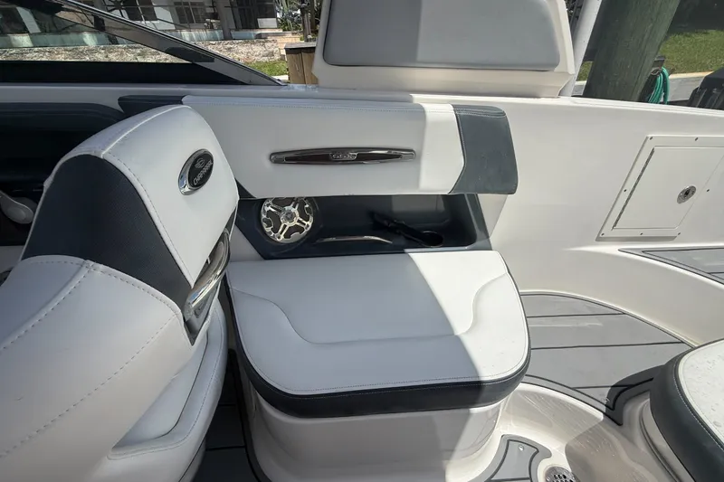Slide: The Image of 2020 Chaparral 257 SSX boat interior with white seating and sleek design. - 14