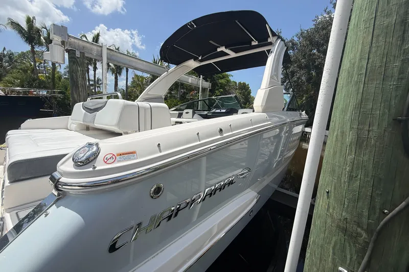 Slide: The Image of 2020 Chaparral 257 SSX boat docked, featuring sleek design and comfortable seating. - 4