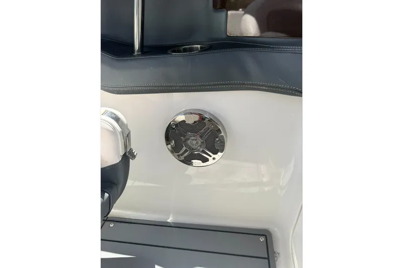 Slide: The Image of 2020 Chaparral 257 SSX boat interior with speaker and cup holder. - 23