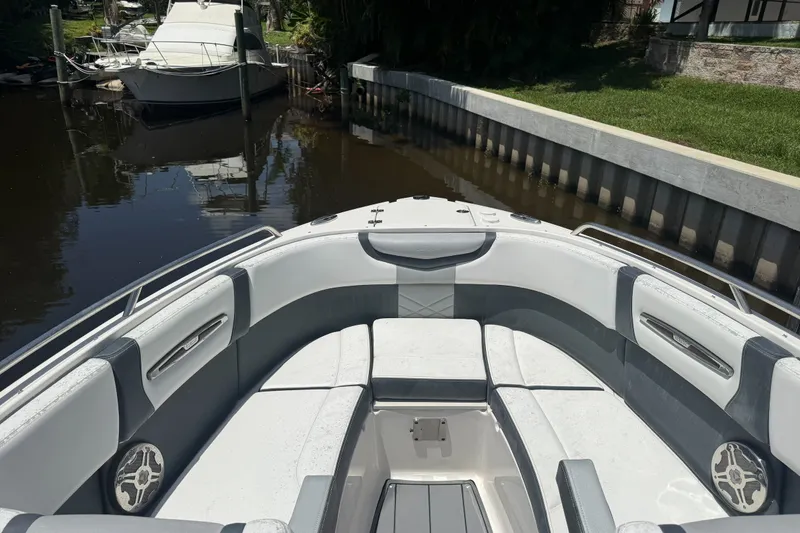 Slide: The Image of 2020 Chaparral 257 SSX boat interior with sleek seating and waterfront view. - 6