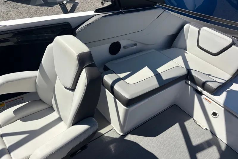 Slide: The Image of 2023 Yamaha Boats AR250 interior seating with modern design and comfortable upholstery. - 17