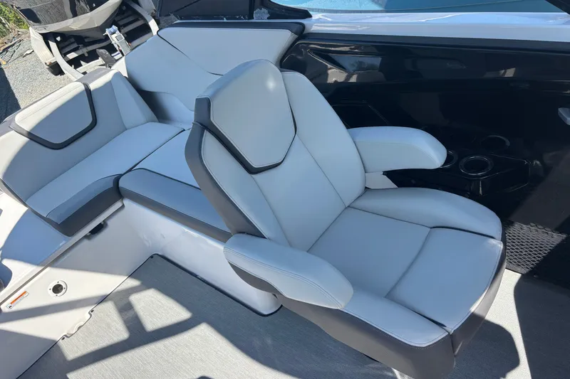 Slide: The Image of 2023 Yamaha Boats AR250 interior seating with modern design and comfortable upholstery. - 16
