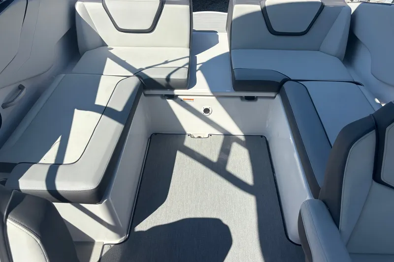 Slide: The Image of 2023 Yamaha Boats AR250 interior seating with modern design and comfortable upholstery. - 7