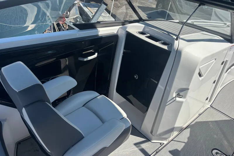 Slide: The Image of 2023 Yamaha Boats AR250 interior with sleek seating and modern console design. - 9