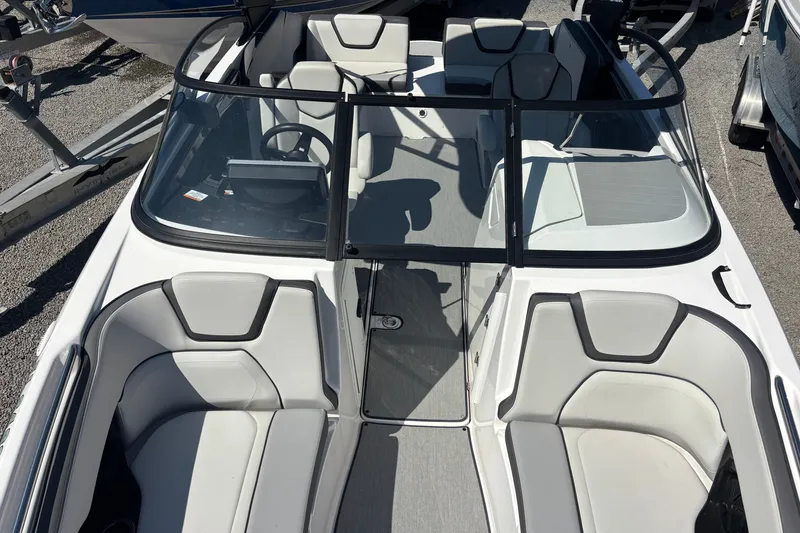 Slide: The Image of 2023 Yamaha Boats AR250 interior with sleek seating and modern design. - 14