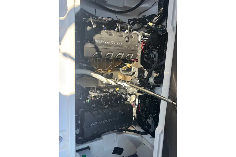 Slide: The Image of 2023 Yamaha Boats AR250 engine compartment showcasing high-output engines and wiring. - 19