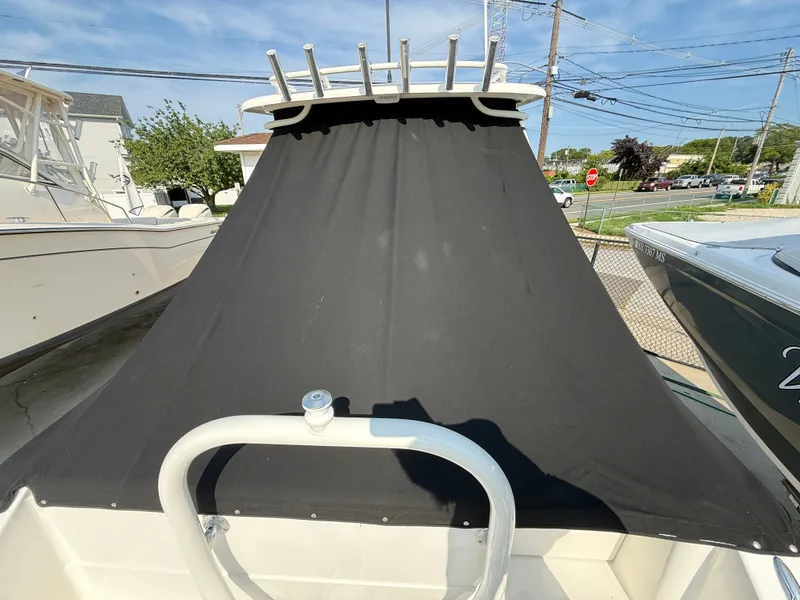 Slide: The Image of A 2019 Pursuit DC 265 Dual Console with a black cover over the cockpit area. - 3