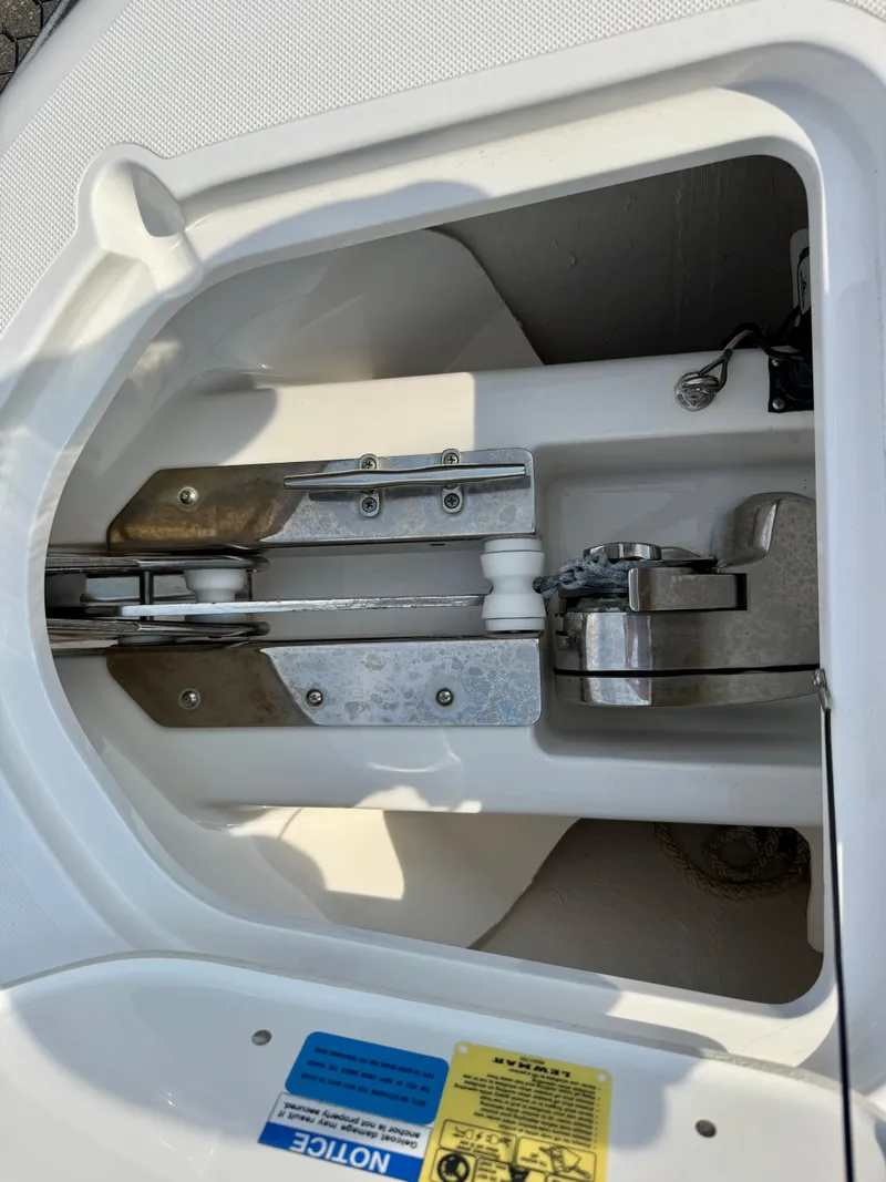 Slide: The Image of An anchor compartment with a mounted anchor system and chain guide. - 28