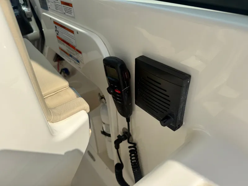 Slide: The Image of A radio and speaker are mounted on the interior wall of a boat. - 21