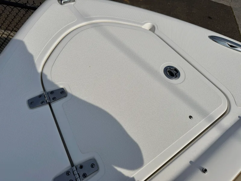 Slide: The Image of Close-up of a boat deck with a storage hatch and hinges. - 27