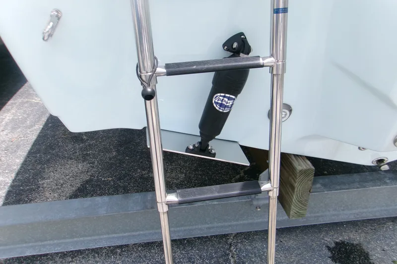 Slide: The Image of Stainless steel ladder on 2026 Key West 239 FS boat, featuring Bennett trim tab. - 5