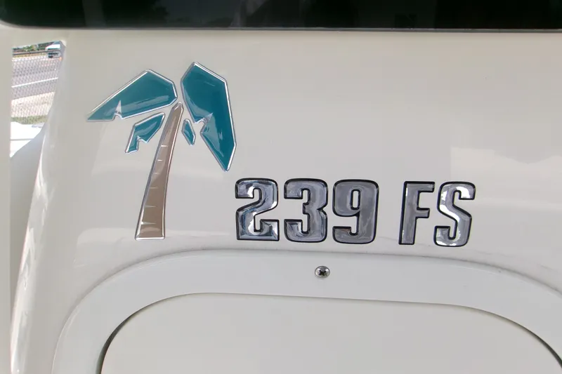 Slide: The Image of Key West 239 FS 2026 boat emblem with palm tree design. - 18