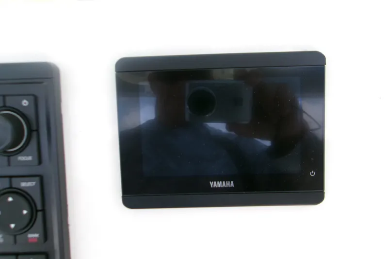 Slide: The Image of Yamaha display panel on 2026 Key West 239 FS boat dashboard. - 16