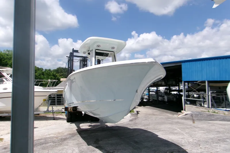 Slide: The Image of 2026 Key West 239 FS boat on display under a sunny sky. - 2