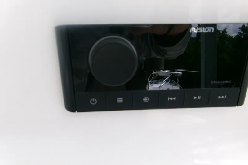 Slide: The Image of Close-up of a Fusion audio system on a 2026 Key West 239 FS boat. - 17