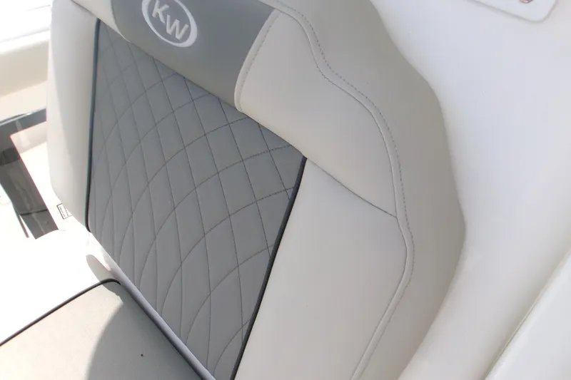Slide: The Image of 2026 Key West 239 FS boat seat with quilted gray and white upholstery. - 9