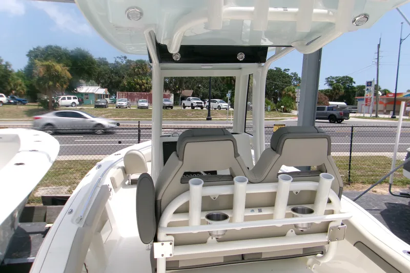 Slide: The Image of 2026 Key West 239 FS boat interior with dual seats and rod holders. - 6