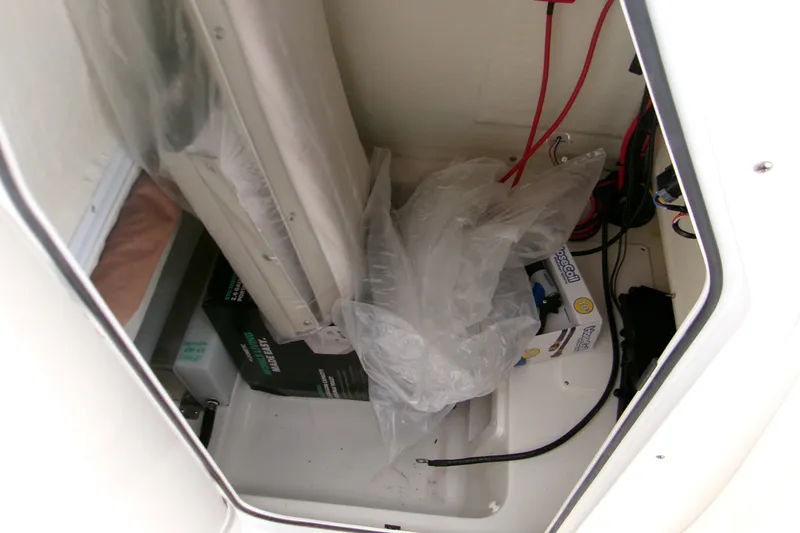 Slide: The Image of Storage compartment of 2026 Key West 239 FS boat with cables and equipment. - 12