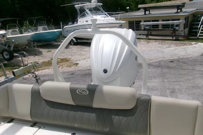 Slide: The Image of 2026 Key West 239 FS boat with Yamaha engine, parked outdoors. - 8
