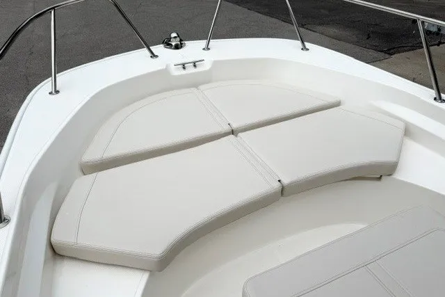 Slide: The Image of 2027 Boston Whaler 170 Montauk boat interior with cushioned seating area. - 8