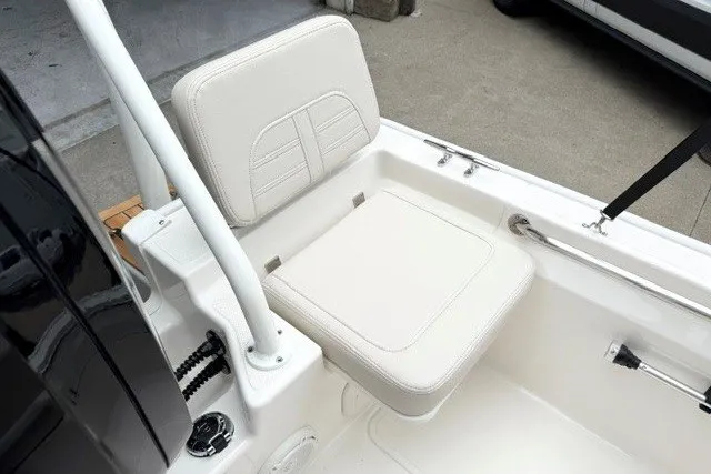 Slide: The Image of 2027 Boston Whaler 170 Montauk boat seat, featuring white cushioned design and sleek finish. - 11