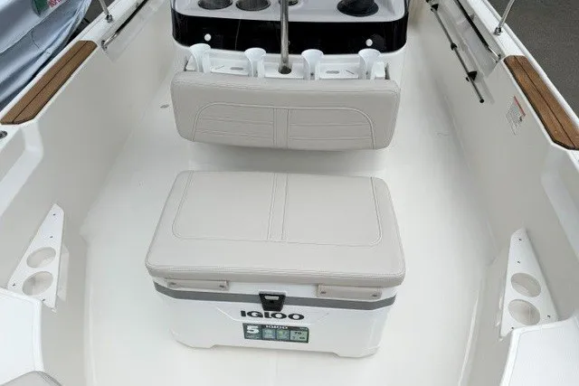 Slide: The Image of 2027 Boston Whaler 170 Montauk interior with Igloo cooler and seating arrangement. - 7