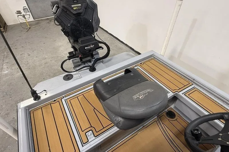 Slide: The Image of 2023 Gator Tail 1860 Extreme boat interior with motor and seating. - 5
