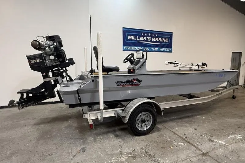 Slide: The Image of 2023 Gator Tail 1860 Extreme boat on trailer at Miller's Marine showroom. - 2
