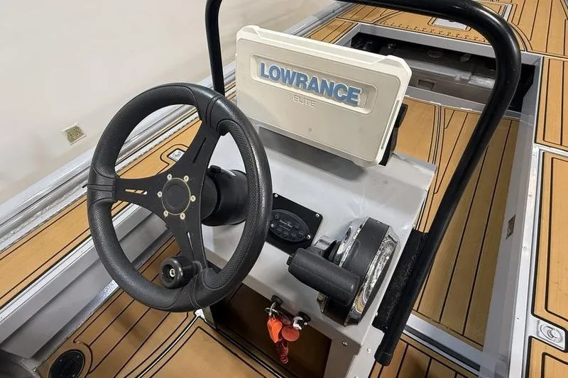Slide: The Image of 2023 Gator Tail 1860 Extreme boat console with Lowrance Elite system and steering wheel. - 7