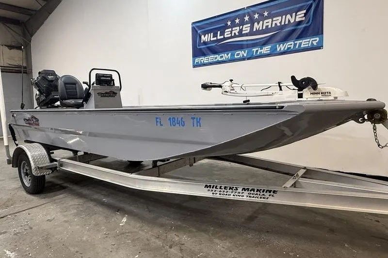 Slide: The Image of 2023 Gator Tail 1860 Extreme boat on trailer at Miller's Marine showroom. - 1