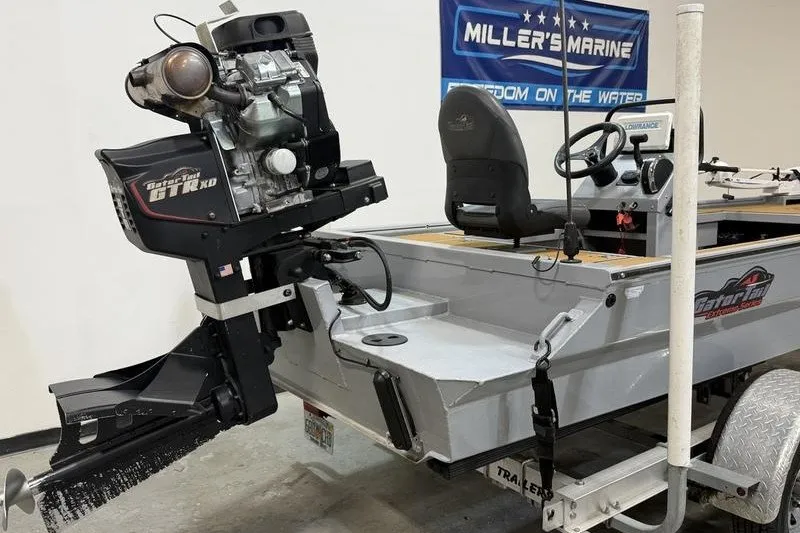 Slide: The Image of 2023 Gator Tail 1860 Extreme boat with powerful outboard motor in showroom. - 3