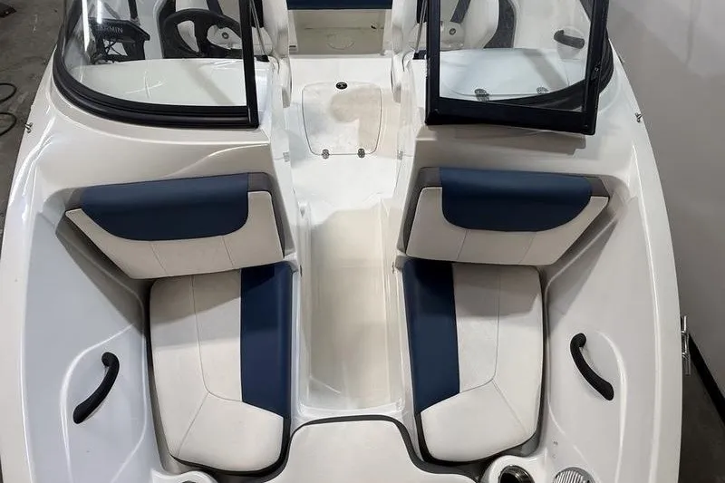Slide: The Image of 2021 Tahoe 450 TS boat interior with blue and white seating. - 15