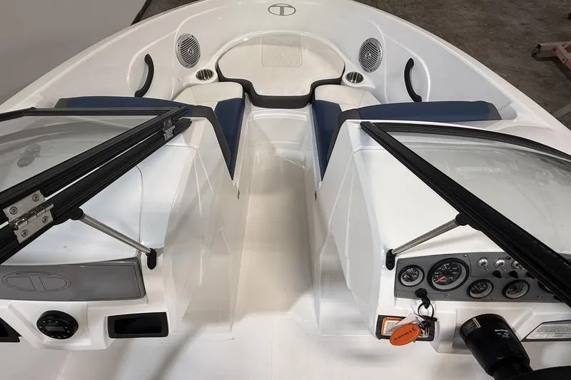 Slide: The Image of Interior view of a 2021 Tahoe 450 TS boat with seating and dashboard. - 16