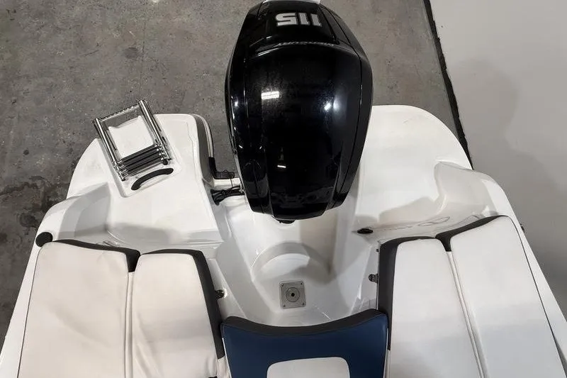 Slide: The Image of 2021 Tahoe 450 TS boat with outboard motor and swim platform ladder. - 8