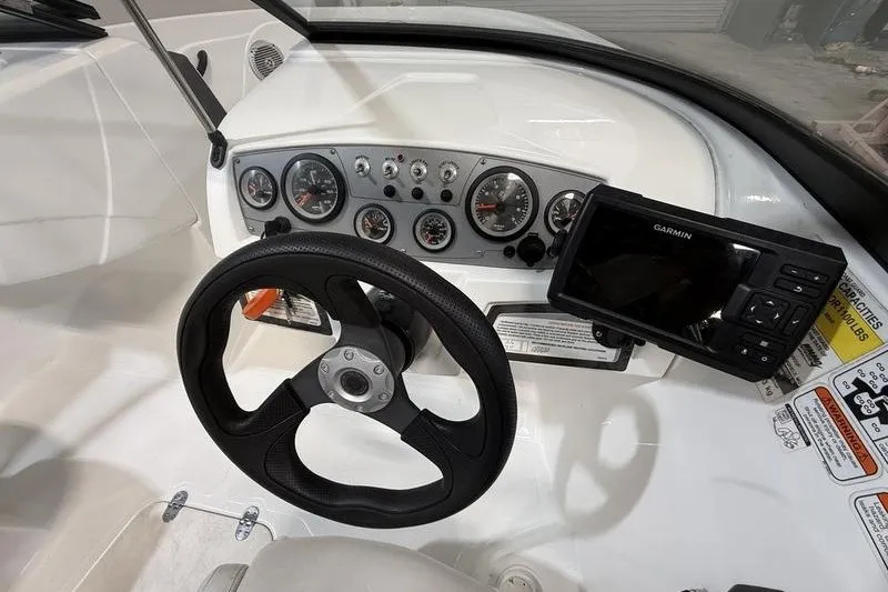 Slide: The Image of Steering console of 2021 Tahoe 450 TS boat with Garmin navigation system. - 10