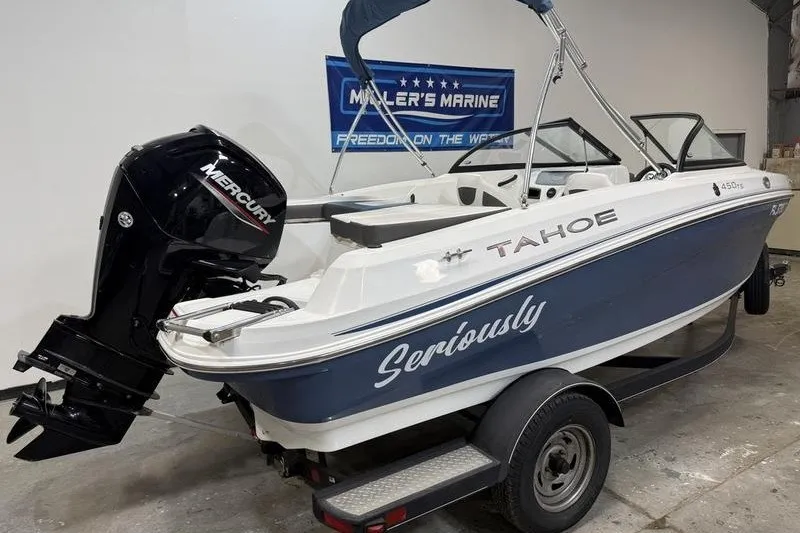 Slide: The Image of 2021 Tahoe 450 TS boat with Mercury engine on trailer at Miller's Marine showroom. - 3