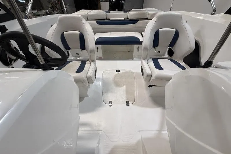 Slide: The Image of Interior of 2021 Tahoe 450 TS boat with white and blue seating. - 14