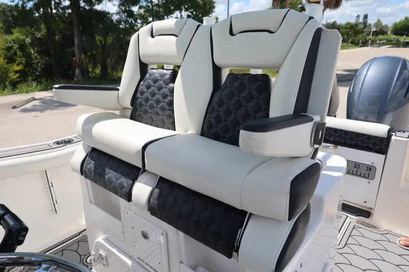 Slide: The Image of Luxury seating on 2021 Tidewater 256 CC Adventure boat, featuring plush, ergonomic design. - 13