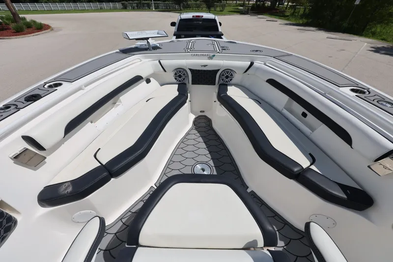 Slide: The Image of 2021 Tidewater 256 CC Adventure boat interior with spacious seating and modern design. - 10