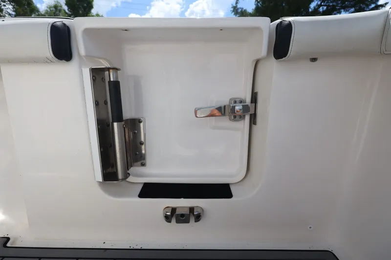 Slide: The Image of 2021 Tidewater 256 CC Adventure boat hatch with stainless steel latch and handle. - 25