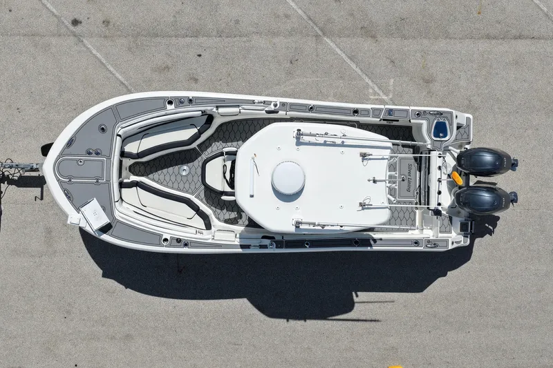 Slide: The Image of Overhead view of 2021 Tidewater 256 CC Adventure boat with dual engines. - 5