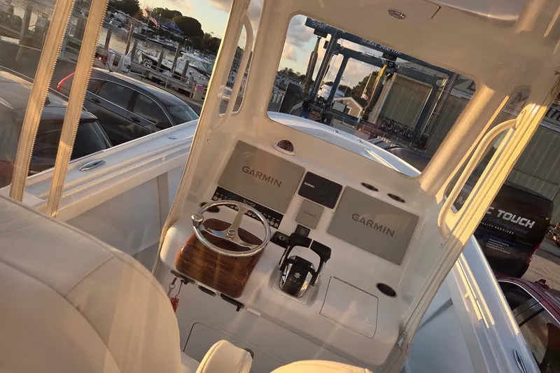 Slide: The Image of 2022 Tidal Creeks Boatworks Center Console with Garmin navigation, docked at sunset. - 40