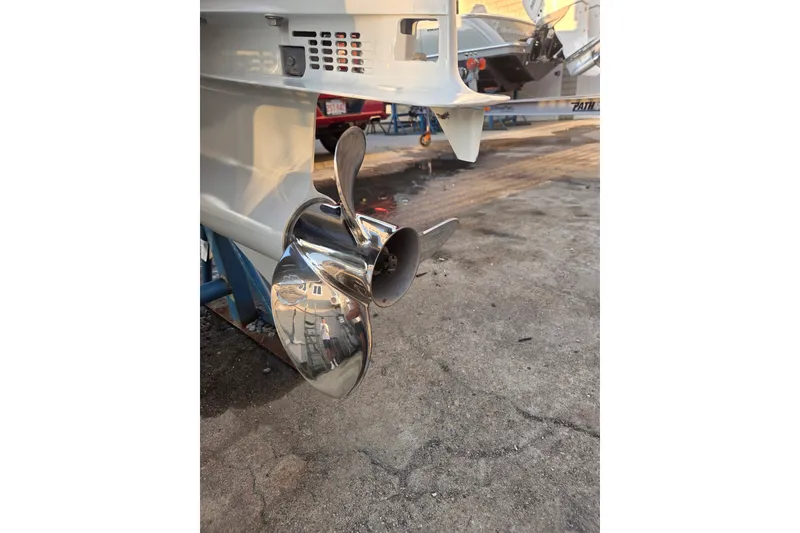 Slide: The Image of 2022 Tidal Creeks Boatworks Center Console with shiny propeller on concrete surface. - 30