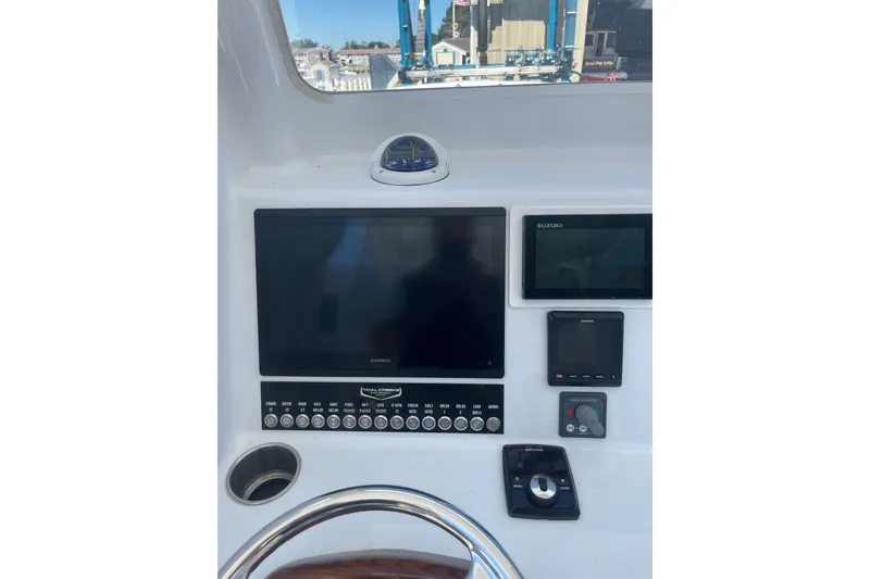 Slide: The Image of 2022 Tidal Creeks Boatworks Center Console dashboard with navigation and control systems. - 14