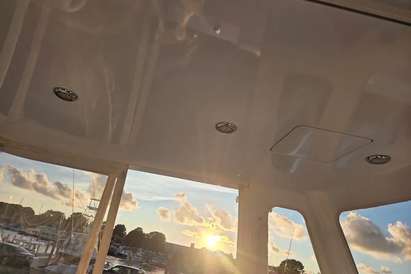 Slide: The Image of Interior view of 2022 Tidal Creeks Boatworks Center Console at sunset, showcasing ceiling details. - 43