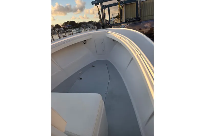 Slide: The Image of 2022 Tidal Creeks Boatworks Center Console interior with sleek design at sunset. - 44