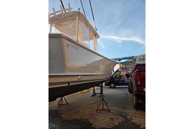 Slide: The Image of 2022 Tidal Creeks Boatworks Center Console on stands, with clear sky background. - 29