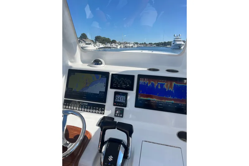 Slide: The Image of 2022 Tidal Creeks Boatworks Center Console dashboard with navigation and sonar displays. - 18