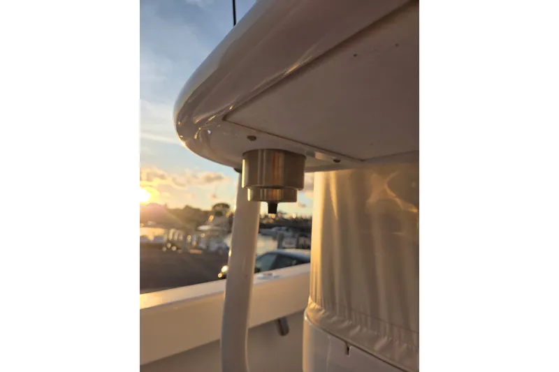 Slide: The Image of 2022 Tidal Creeks Boatworks Center Console detail at sunset, showcasing sleek design elements. - 37