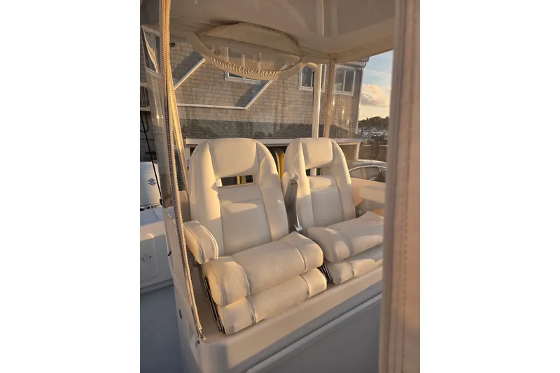 Slide: The Image of 2022 Tidal Creeks Boatworks Center Console with plush white seating in sunlight. - 41